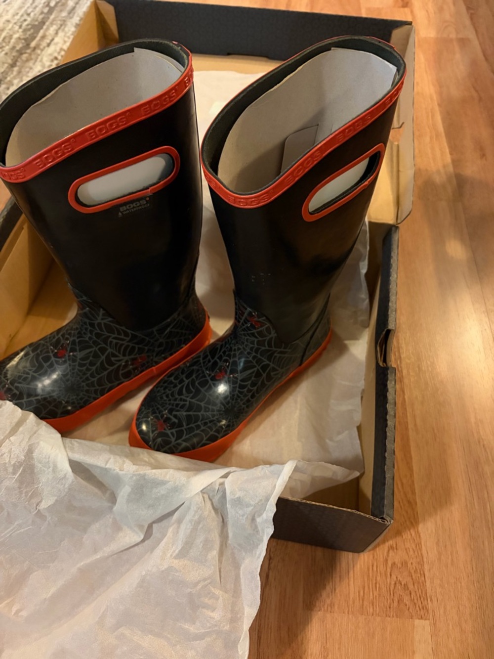 Bogs Black Rain Boots with Orange Trim and Spiderweb Accent